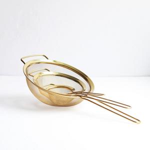Set of gold strainers