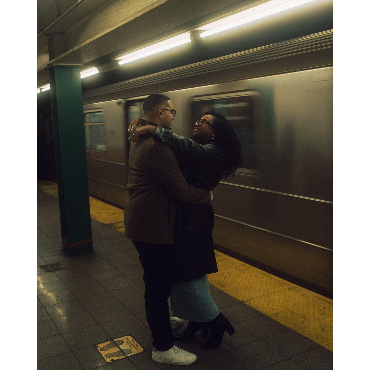Catching a moment on the subway—where countless adventures in the city began for Déja and Kevin.