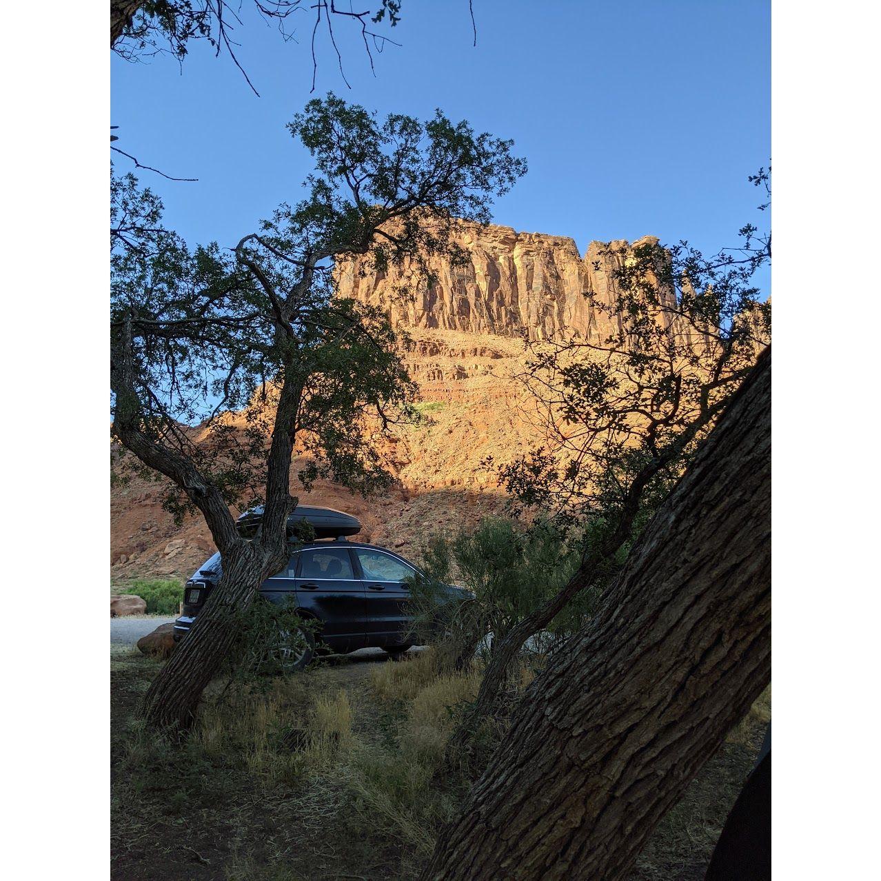 Moved into Rob's car in June 2022, began our cross-country move from PDX to Sav. Our car/home at a campsite in Moab, UT.