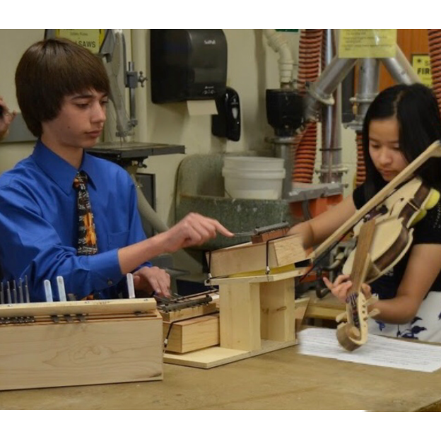 8th grade - Practicing for our Science Olympiad event Sounds of Music in the middle school shop