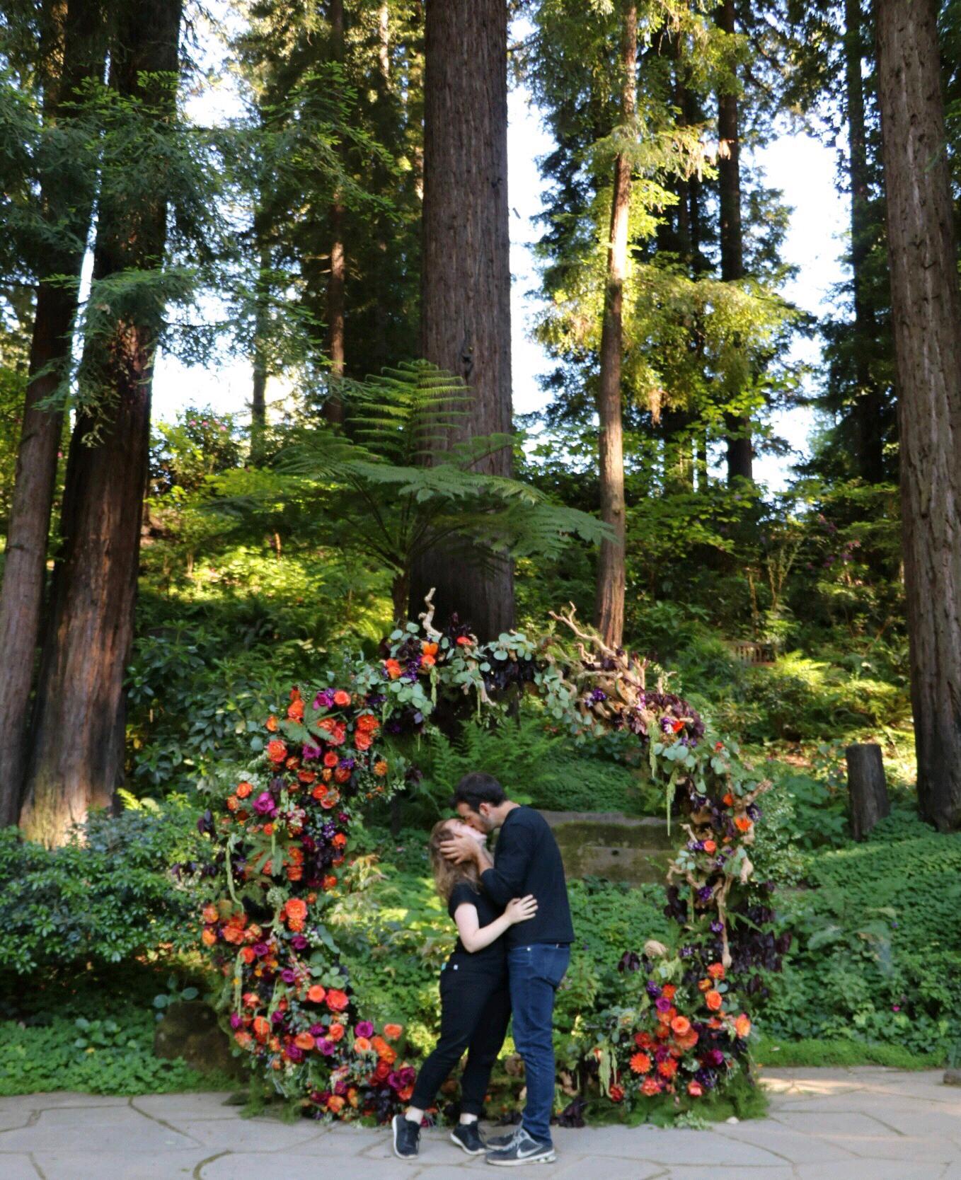 We've enjoyed working together on the weekends with a floral designer who creates masterpieces like this. We couldn't let the opportunity pass to take a picture in front of some of her epic work!