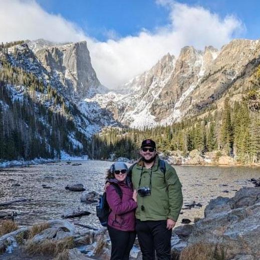 Emerald Lake, Rocky Mountain National Park!
Alt Text: Maeghan and Keiran smiling and wearing sunglasses, bundled up at Emerald Lake with beautiful snow-covered mountains in the background