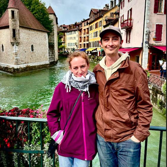 Standing in front of a city canal in Ancy