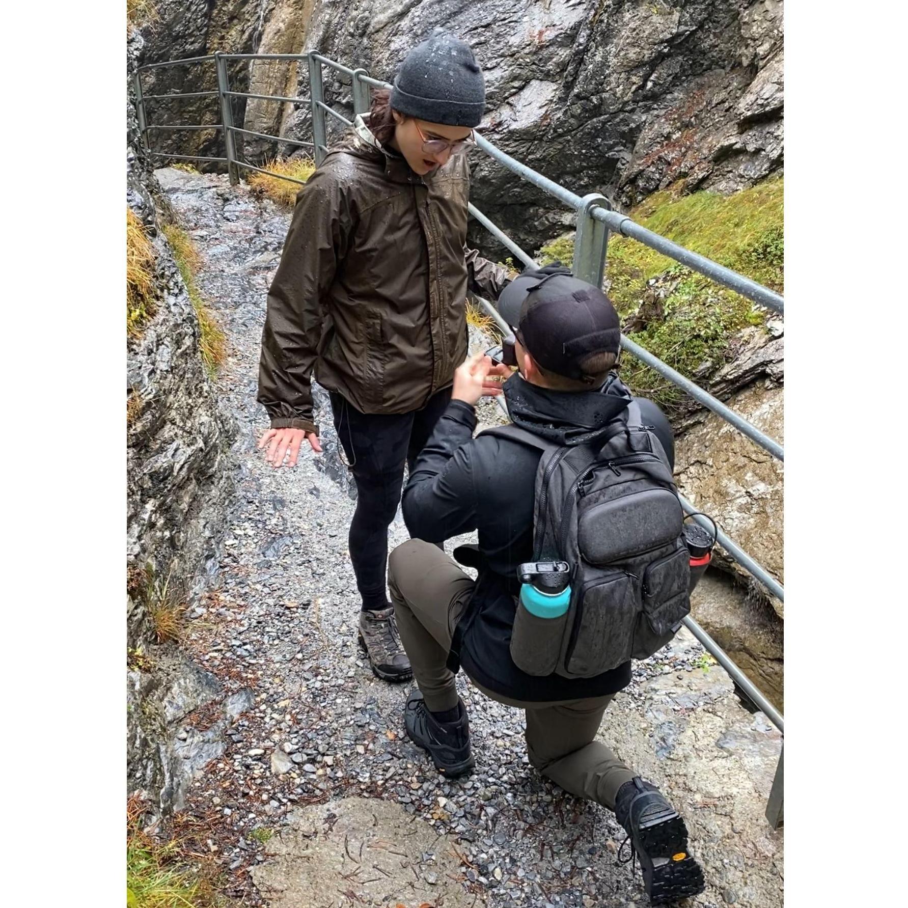 The proposal! In front of a fairytale-like waterfall in Switzerland
