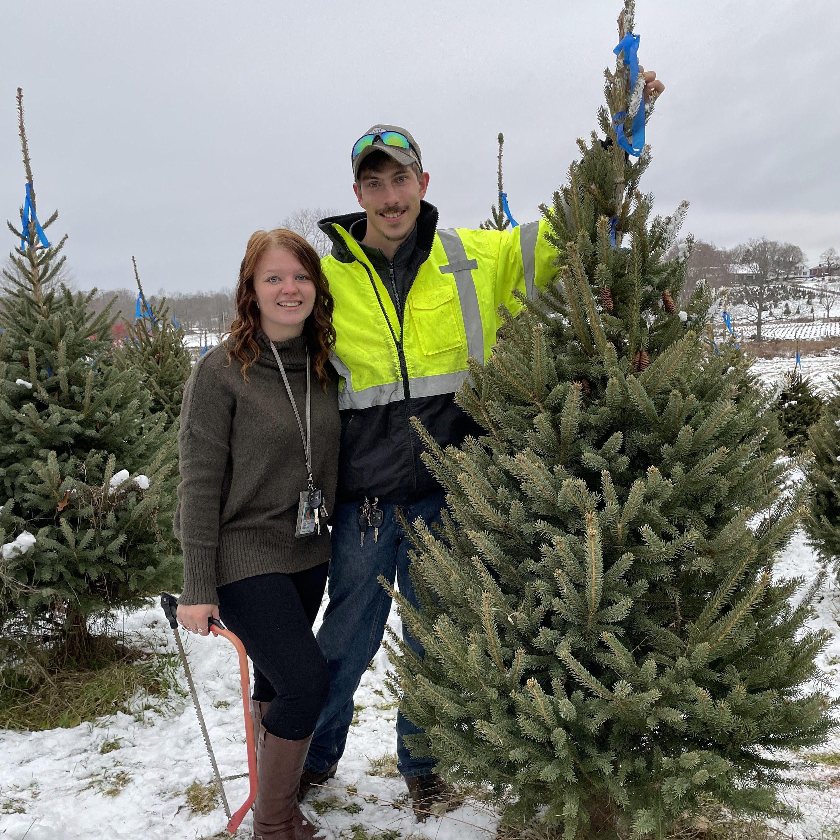 November 28, 2021 - Cutting down our tree for Christmas. It was my (Emily) very first real Christmas tree because my dad had always used fake ones