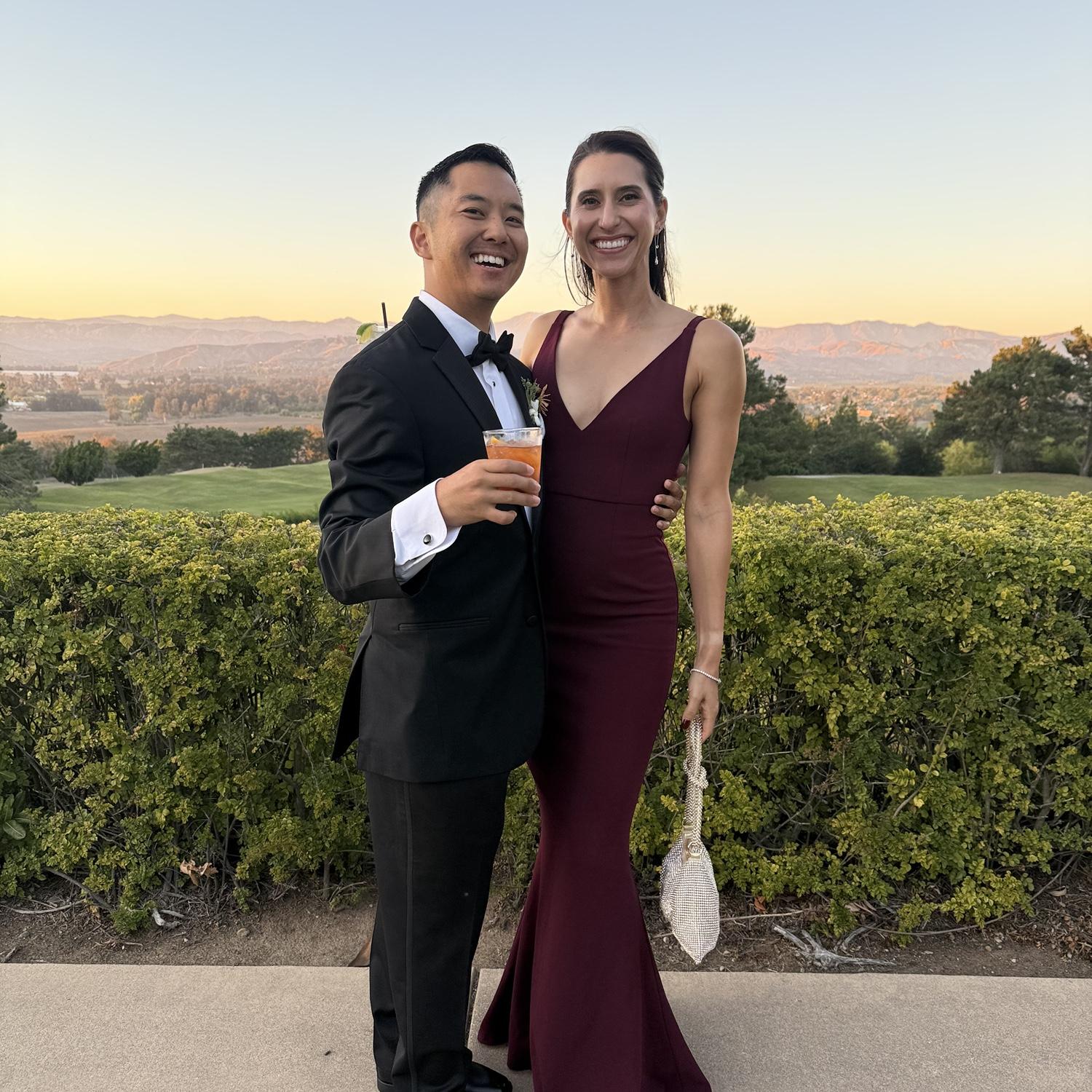 Brandon and Ashlee laughing during cocktail hour at their friends’ Naponpon & Emerald’s wedding