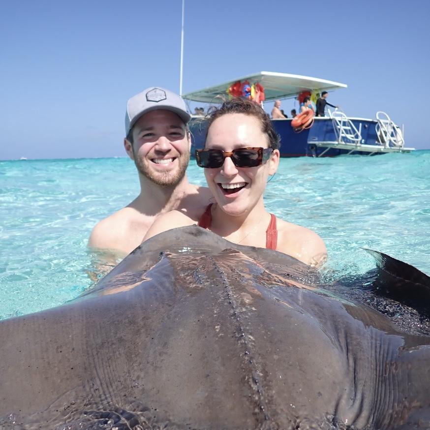 You can kiss Stingrays in the Cayman Islands because "they're friendly here" and tbh they were a little TOO friendly.