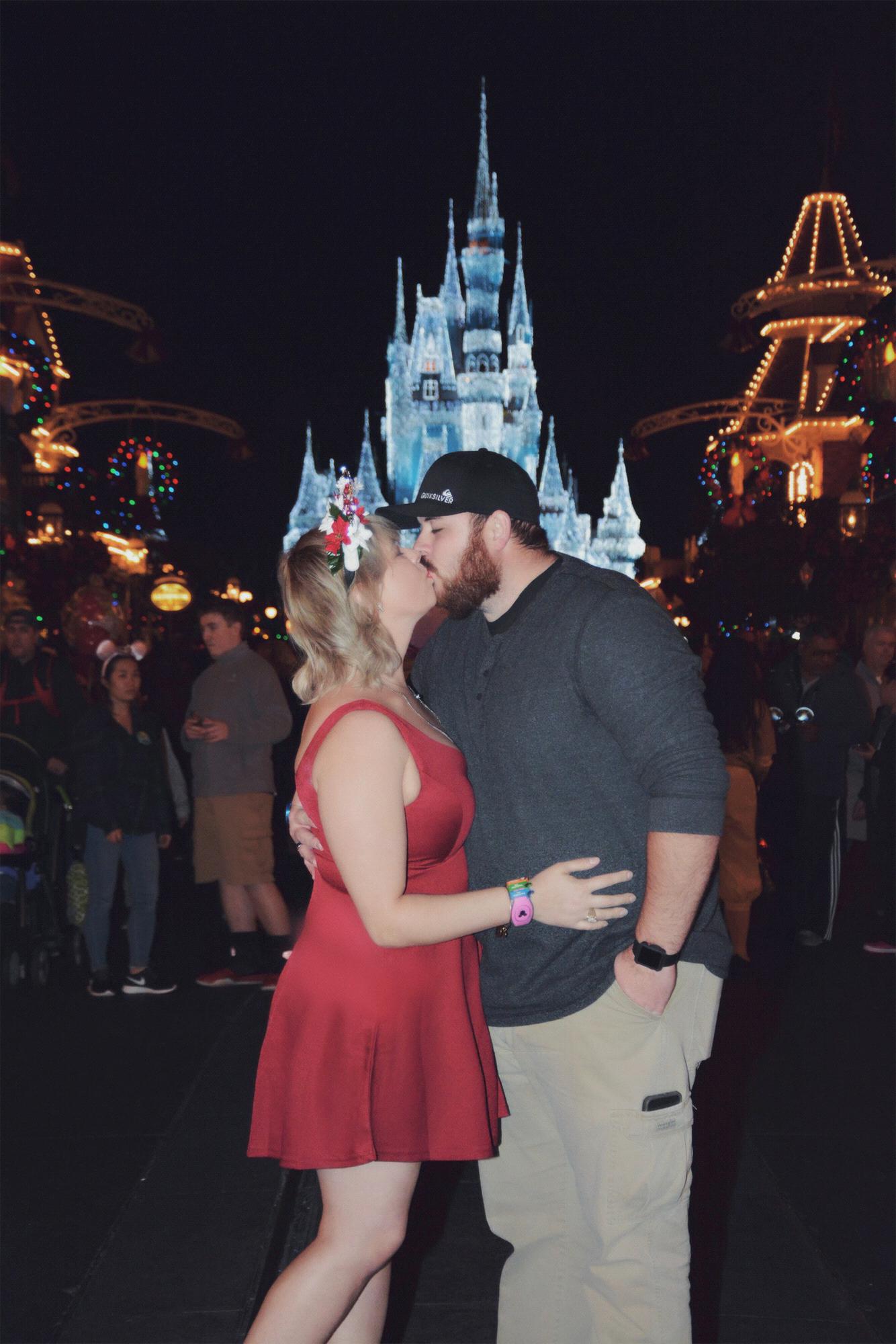 Disney loving couple, and Christmas is the most magical time to be there. Bride had special Christmas ears made for her "romance" pics.