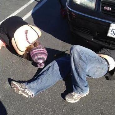 Noah fixing Leah's car