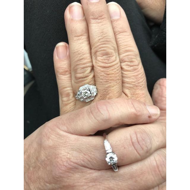 Our rings are completely symbolic. Sally's  represents all of the things that come together to make us who we are, and above all there is love. 
Trish's ring represents two people joined by God.