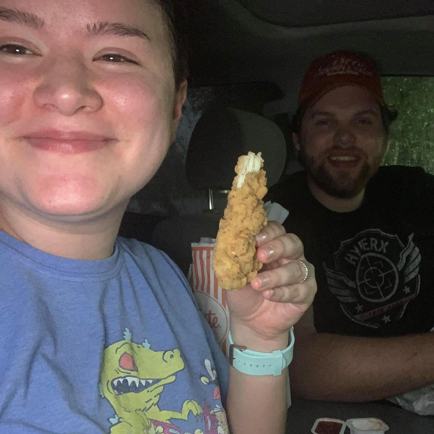 Julia & Stephen enjoying Whataburger in the parking lot during an insane rain/thunder storm