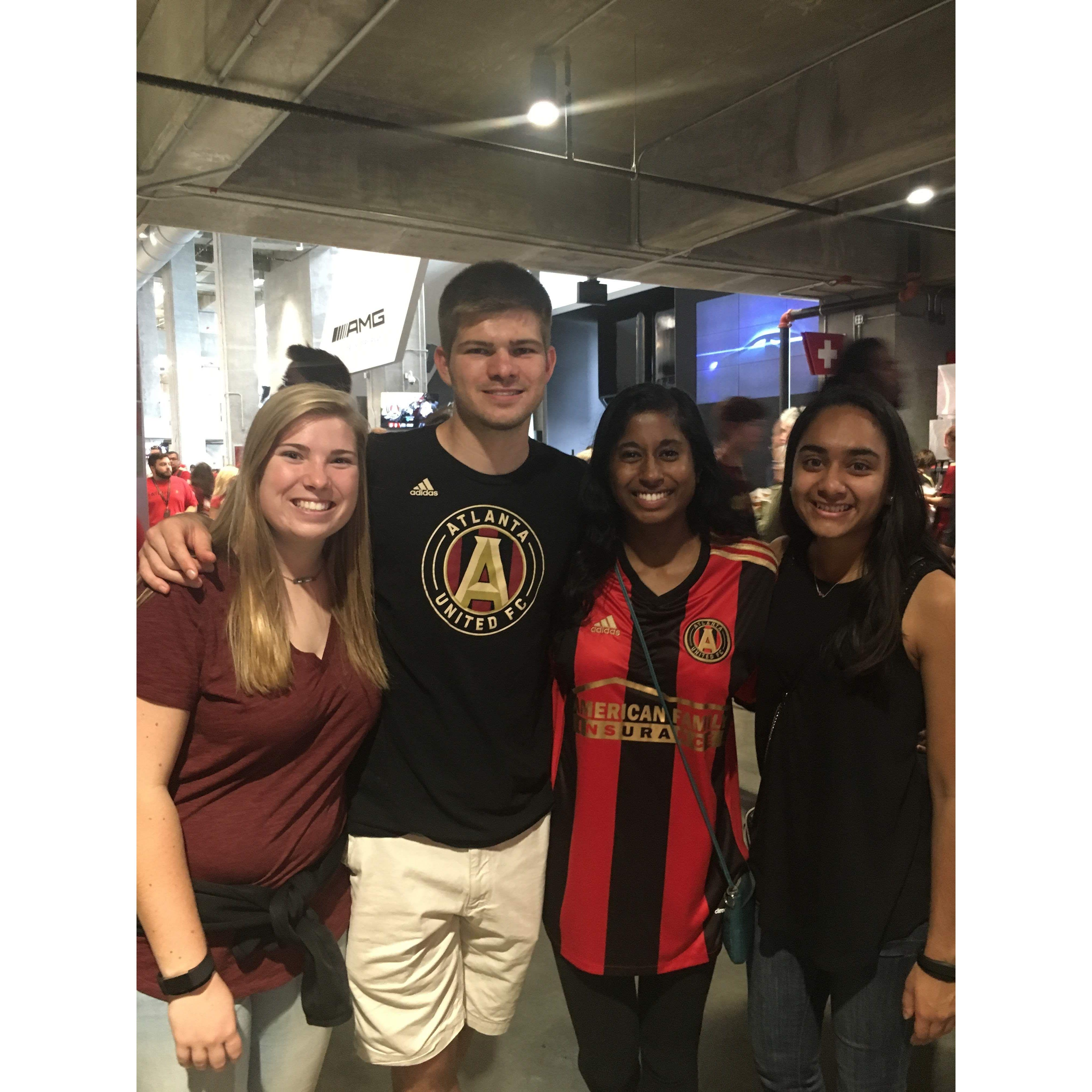 Tim, Sangeetha, Tim's sister Amy, and our friend, Kanchi, at an Atlanta United game in Oct 2017