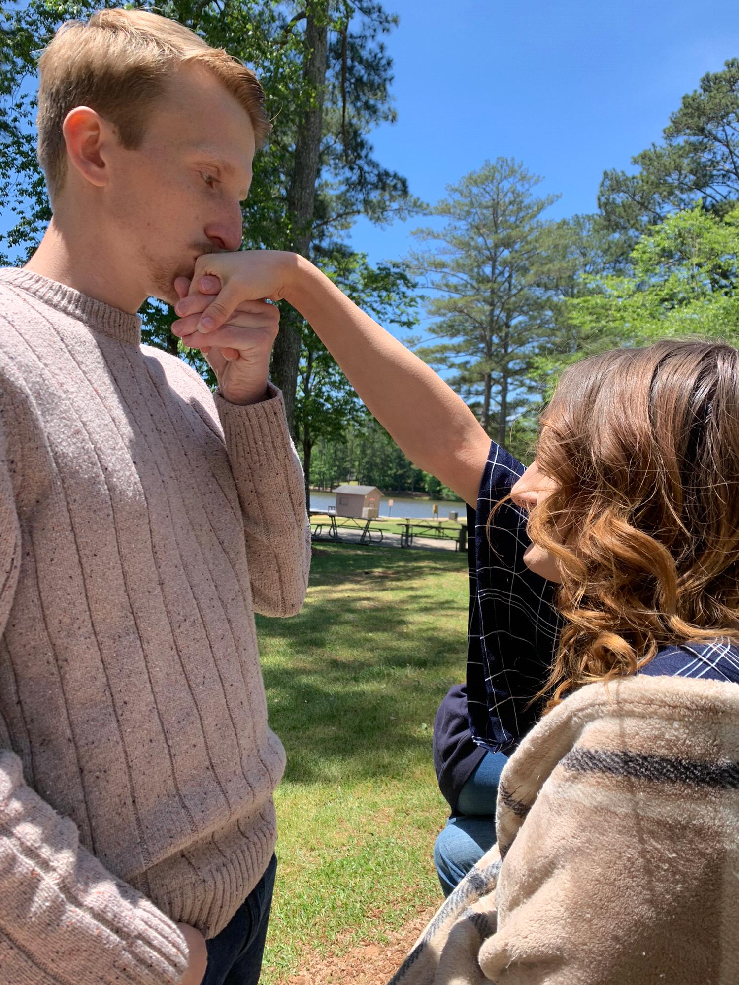 Chase kissing Jessica’s hand on her graduation day.