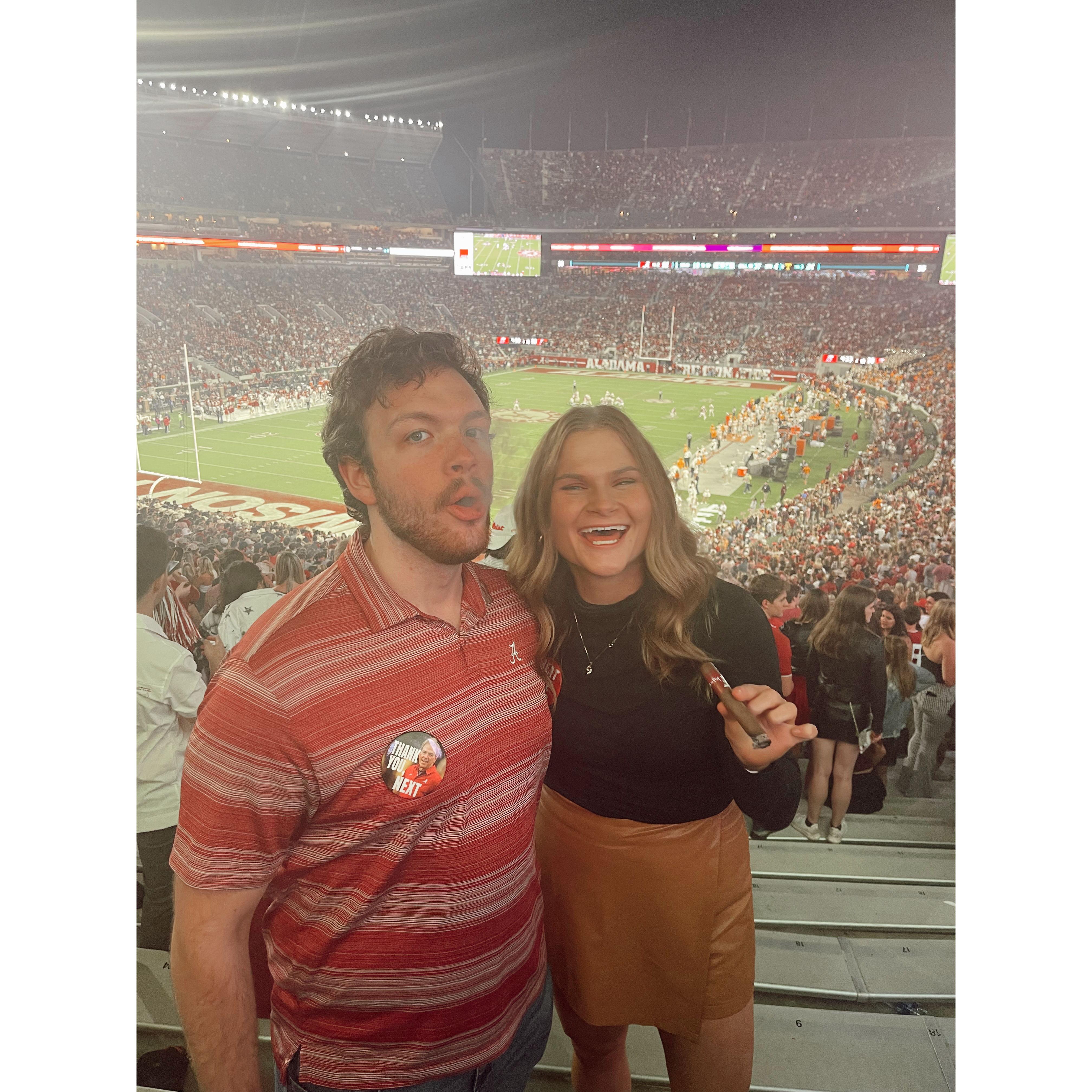 Celebrating the win against Tennessee- every time Alabama beats Tennessee in football, it's tradition to smoke a cigar after the game.