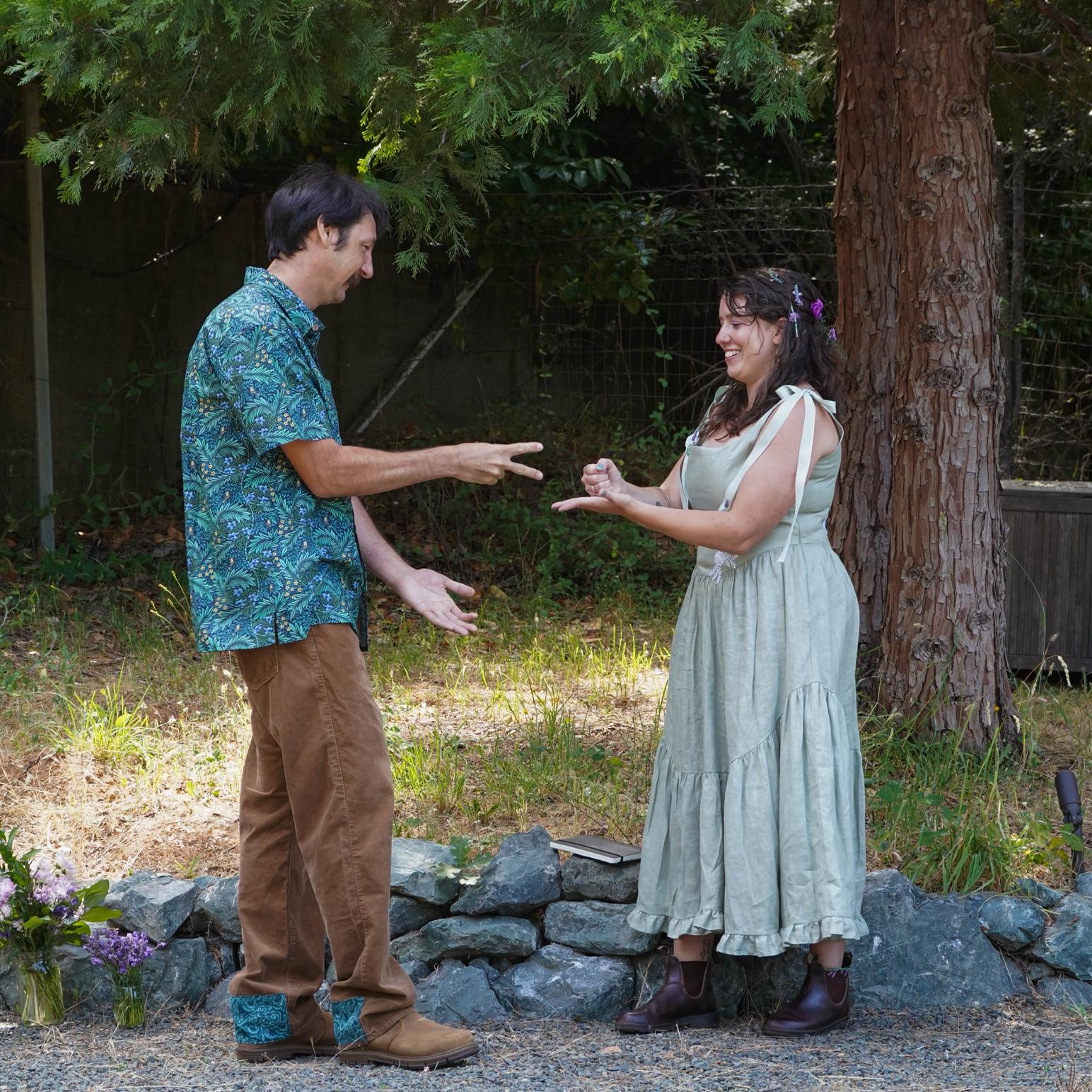 They played rock, paper, scissors to see who would say vows first. After both throwing the same hand two times in a row, Julia won.