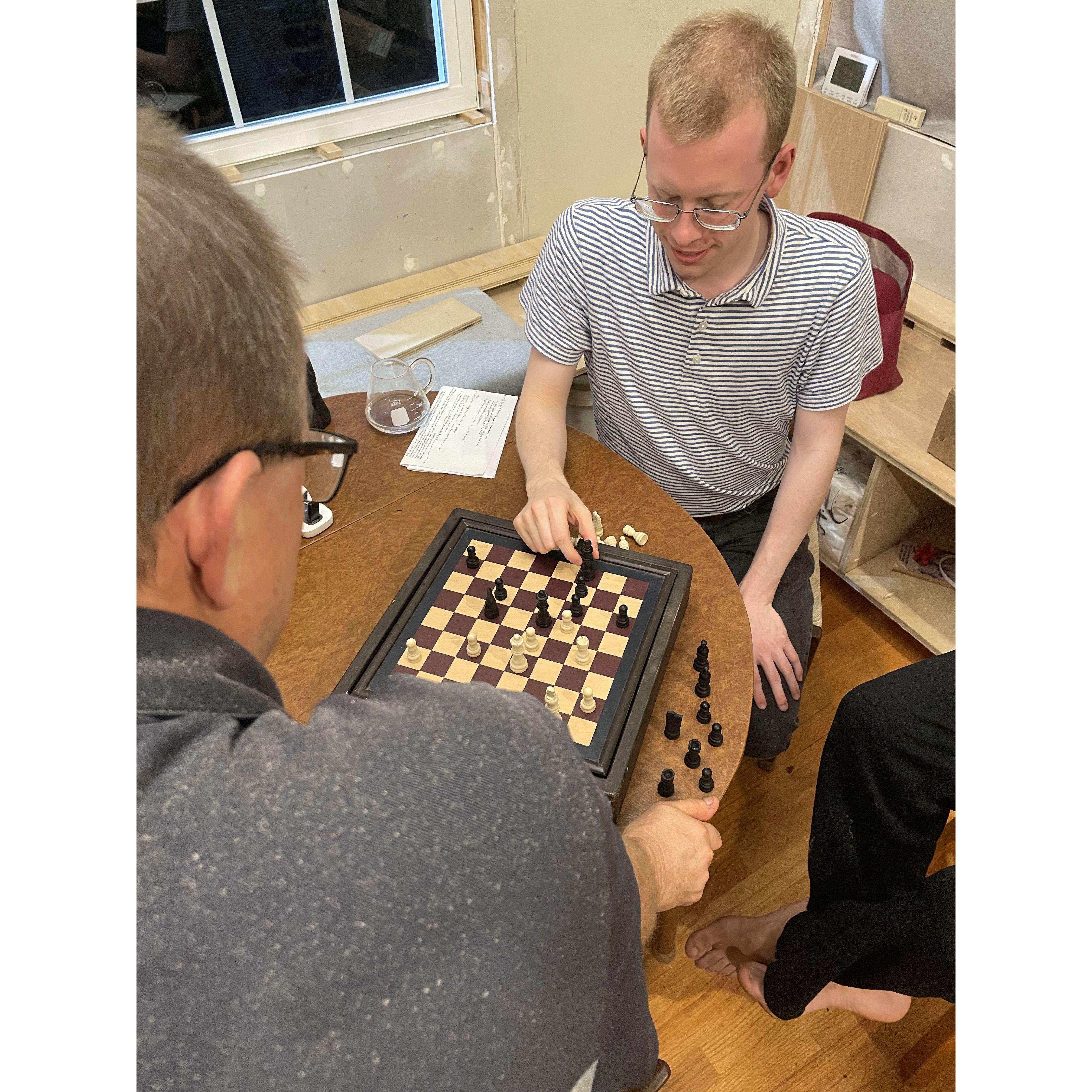 Josiah and Anna Lise's dad playing chess together