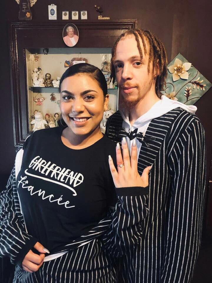 The day it all happened! Christmas morning in our matching onesies ... no the ring didn’t fit but I tried my hardest as you can see from the color of my finger haha