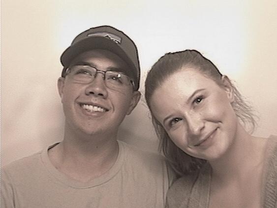 Dustin and Maya in 2018 at a photo booth while on a date