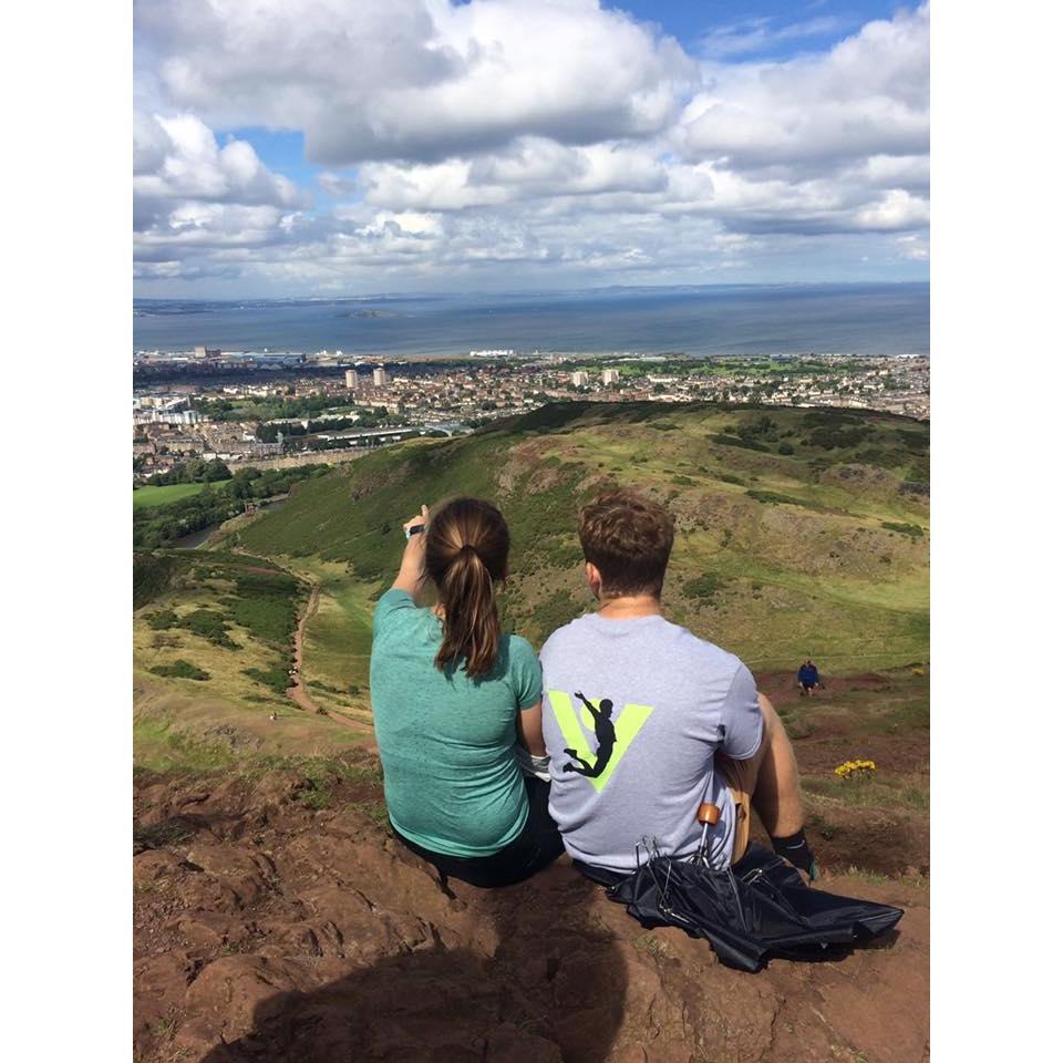 Arthur's Seat in Edinburgh in 2017. Julia is pointing out the next pub stop.