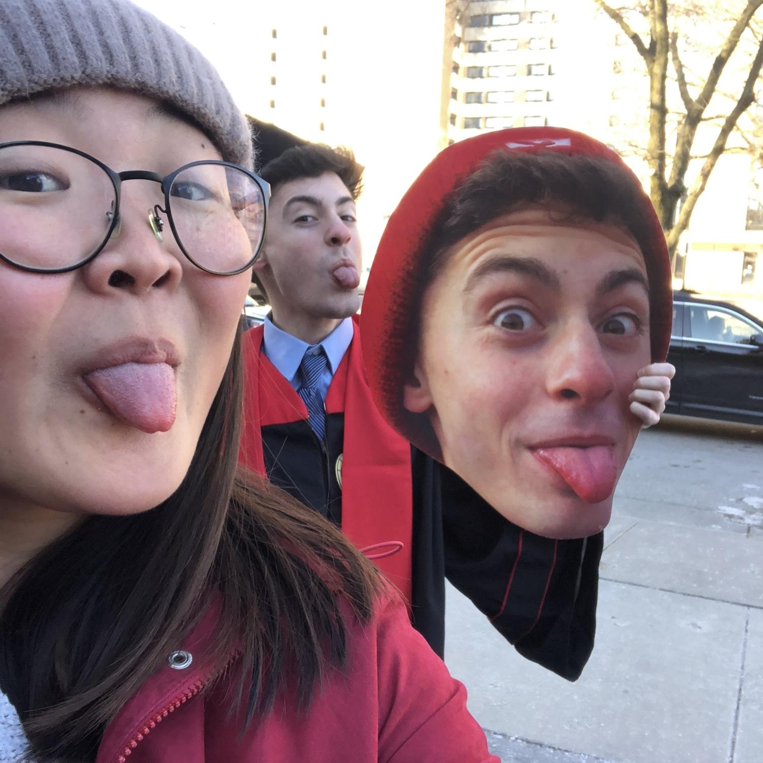 Celebrating John's college graduation. Who did it better: Kristen, John, or John's fathead?