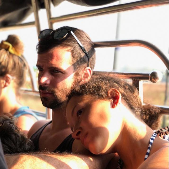 Riding a "bus" (the bed of a truck) to a fishing boat in Myanmar