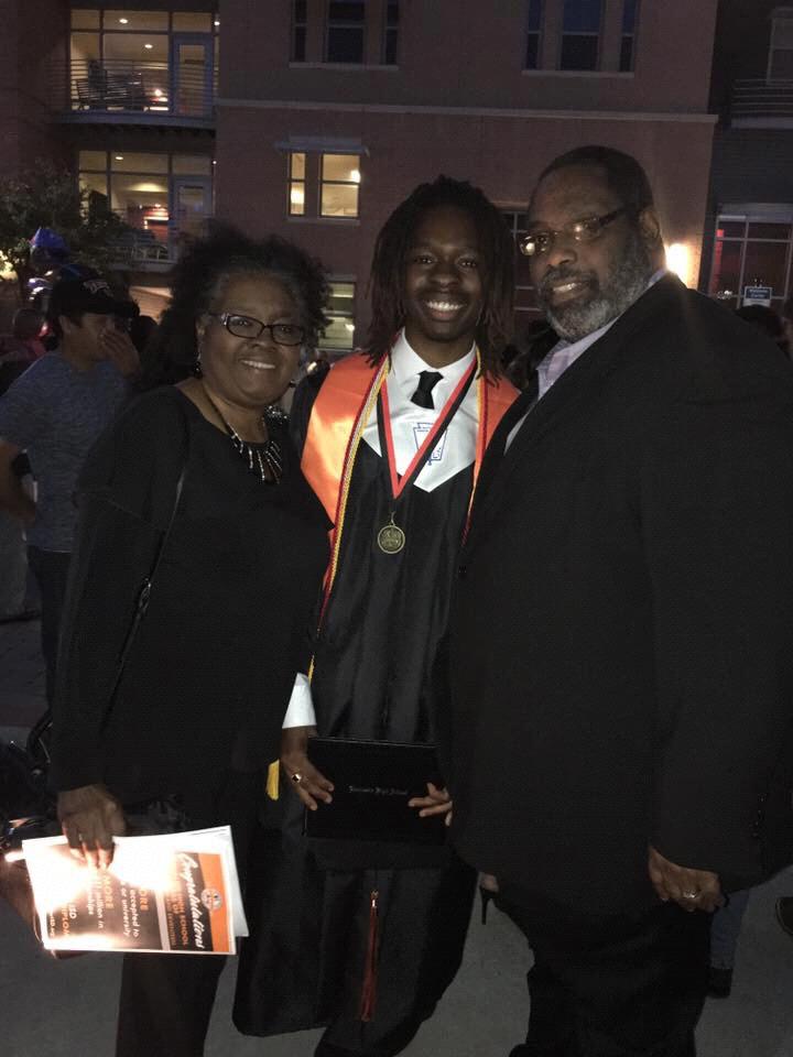 Jordan and his parents at his graduation