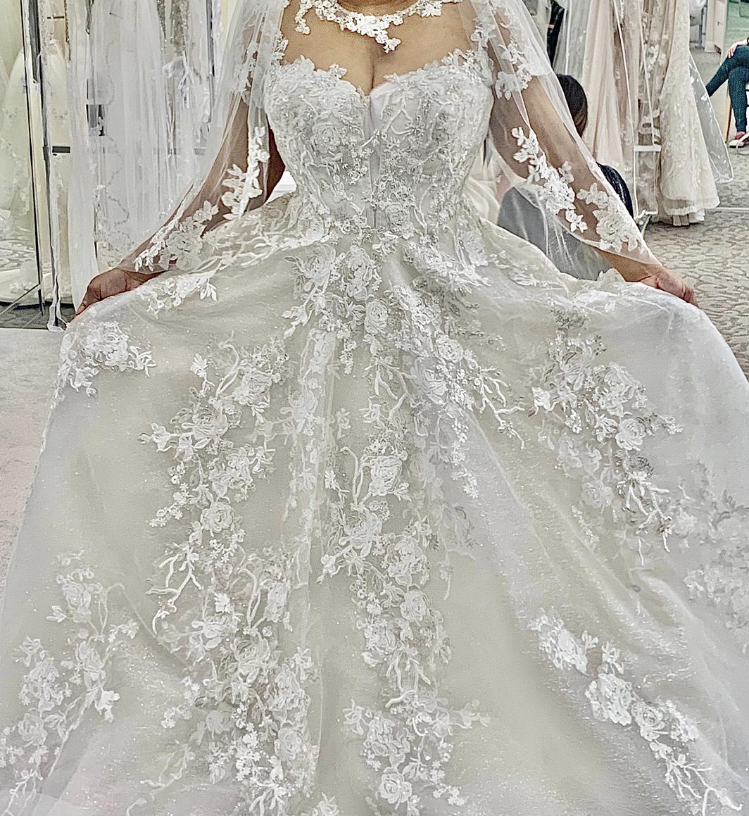 The moment when Mom and I said YES! to this ivory hand-beaded lace Oleg Cassini dress