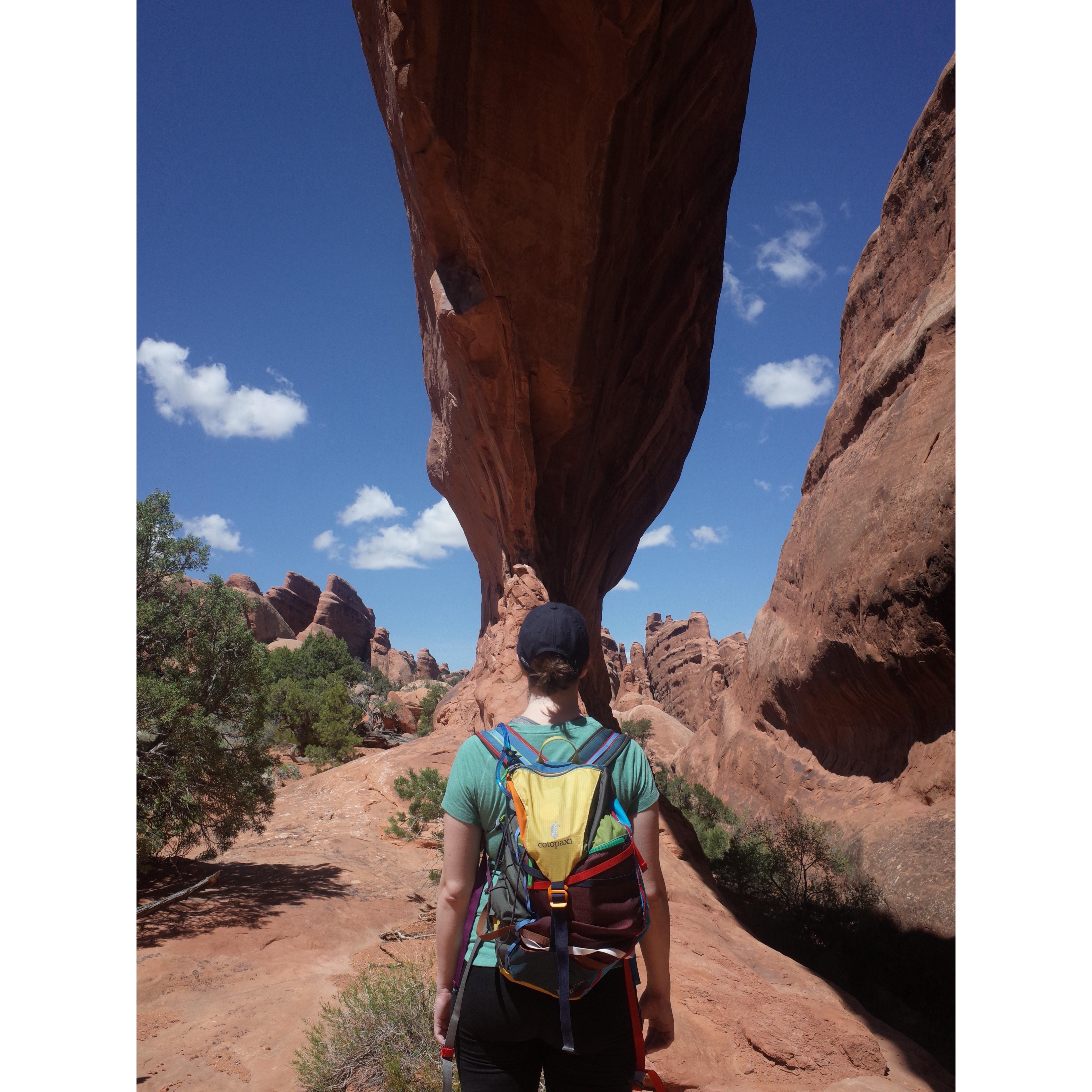 Standing under Hidden Arch in Arches National Park