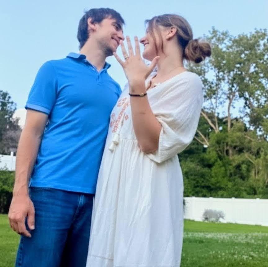 ENGAGED! The perfect moment in our backyard last August.