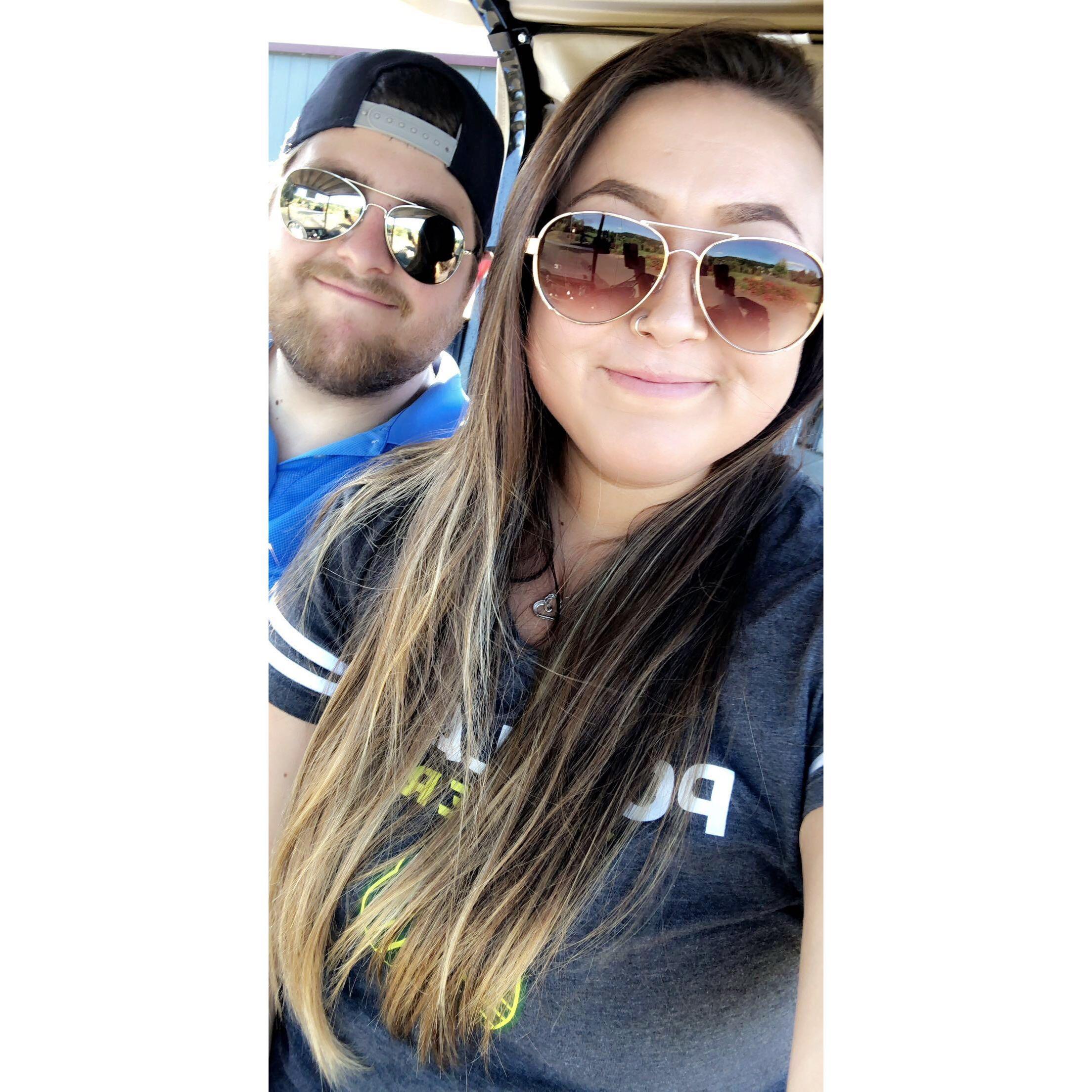 Our first time golfing. He's better than I am.
