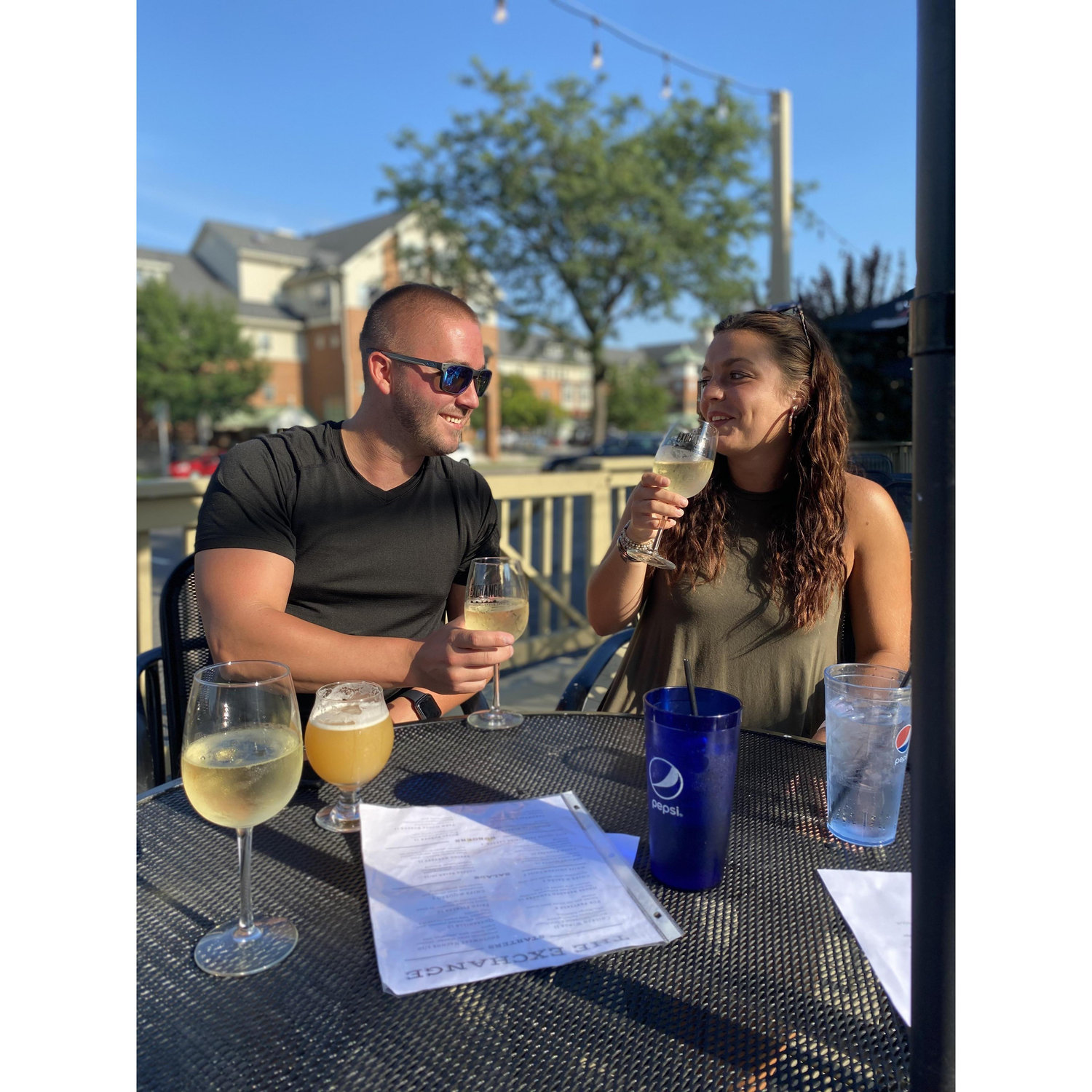 A toast at the bar where we met, right after we bought our house!