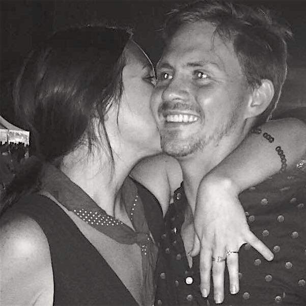 2018. Us celebrating (at another music festival!) after he got down on one knee! (and she said yes of course)