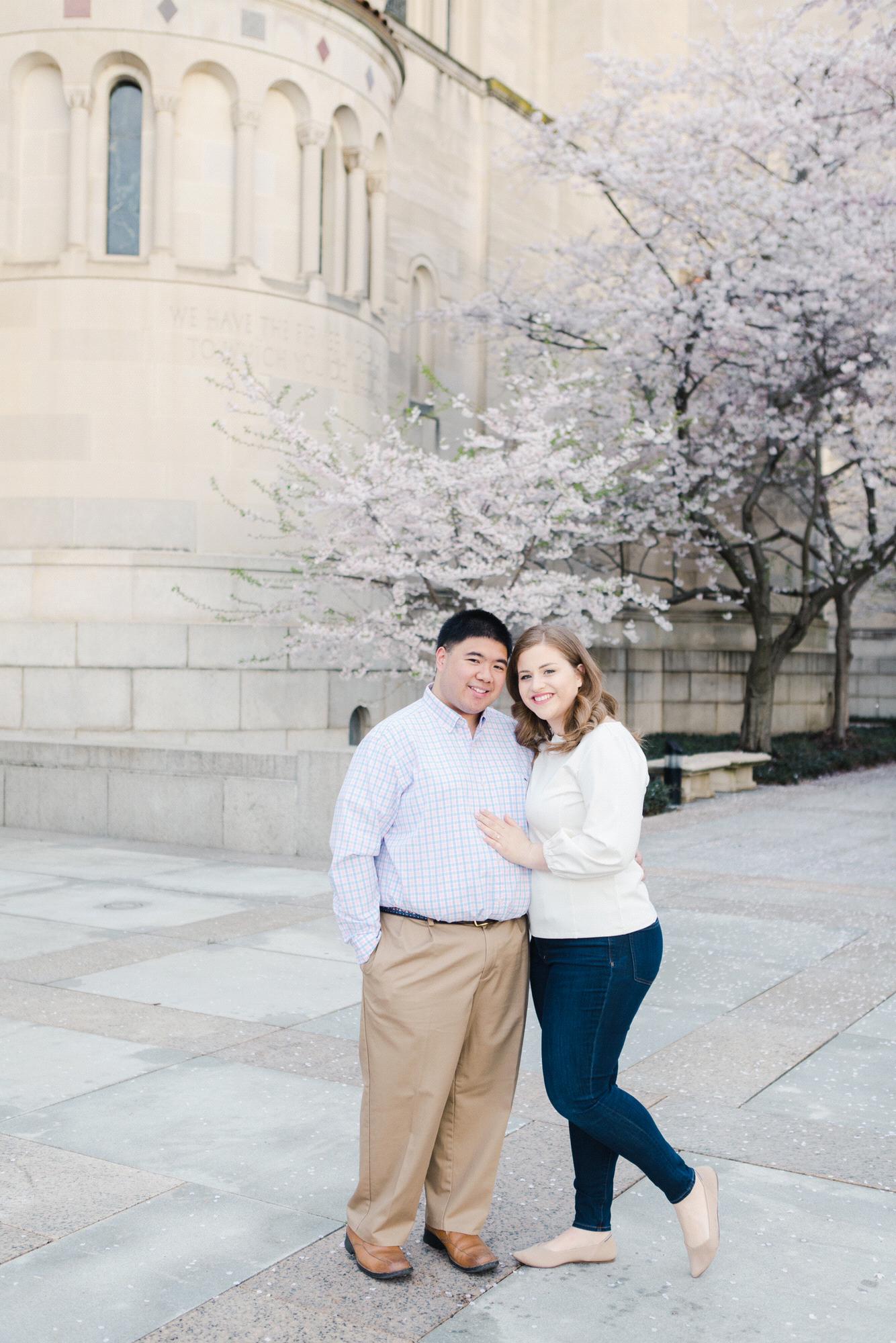 Cherry blossom engagement pictures at the Basilica of the National Shrine of the Immaculate Conception, March 2020. (Kate Grace Photography)