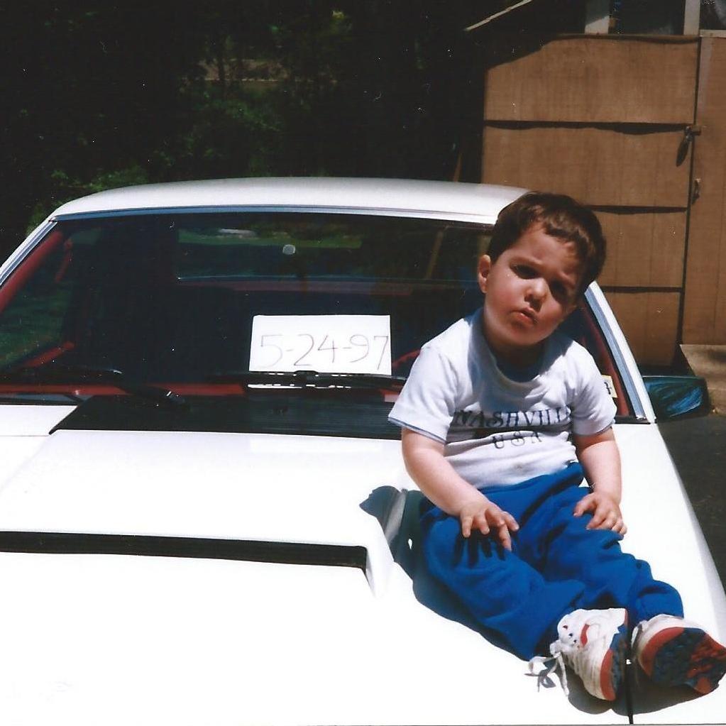 Joe on his dad's vintage Mustang, Henry