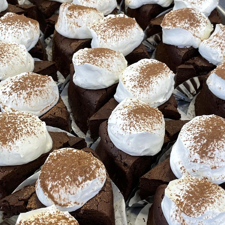 Chocolate event dessert cups topped with cream