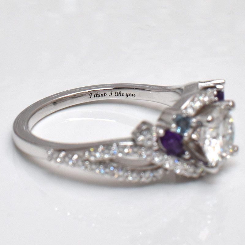 The engagement ring has "I Think I Like You" engraved inside of it, referring to our song, I Think I Like You by The Band Camino.