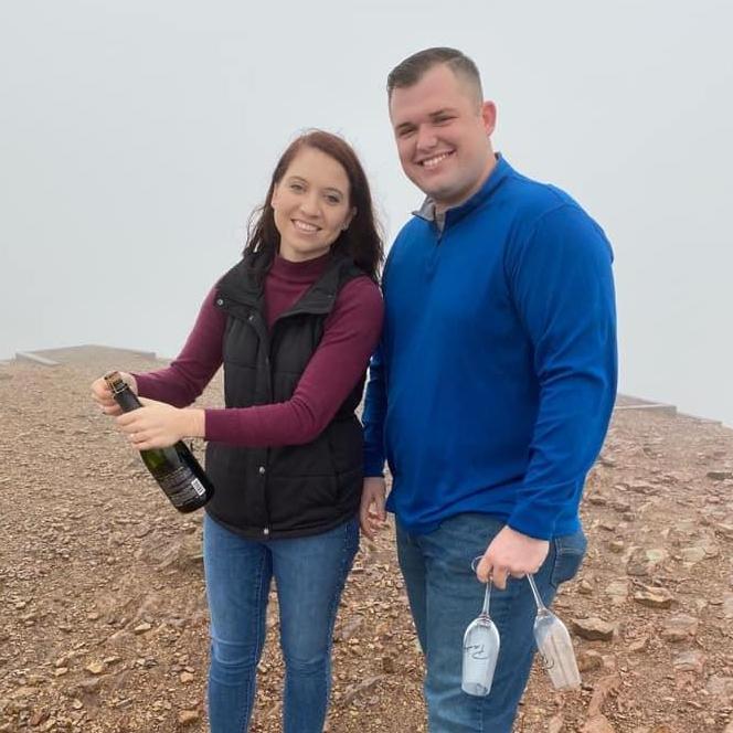 Popping champagne to celebrate our engagement!