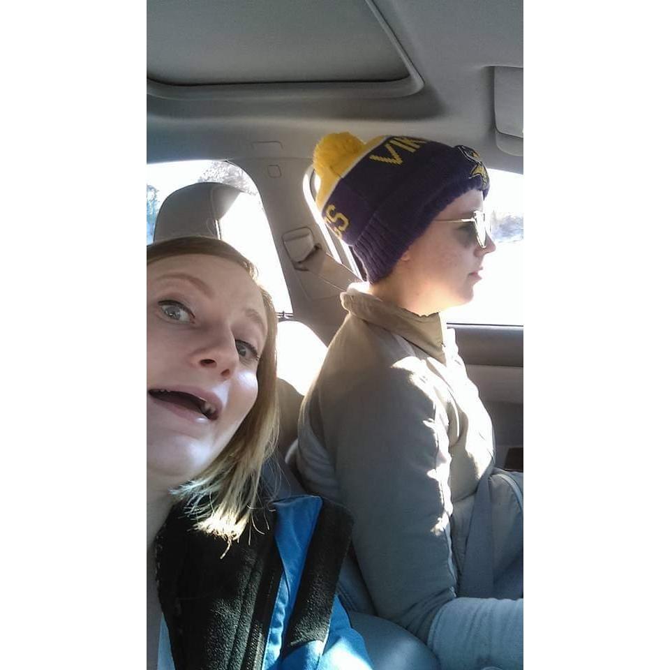 Me bothering Addie on the way to the Onesie Bar Crawl.