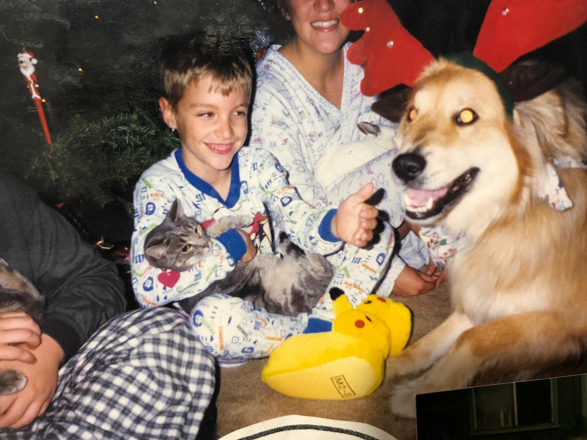 Conner with his dog, Gabe, and "street cat"