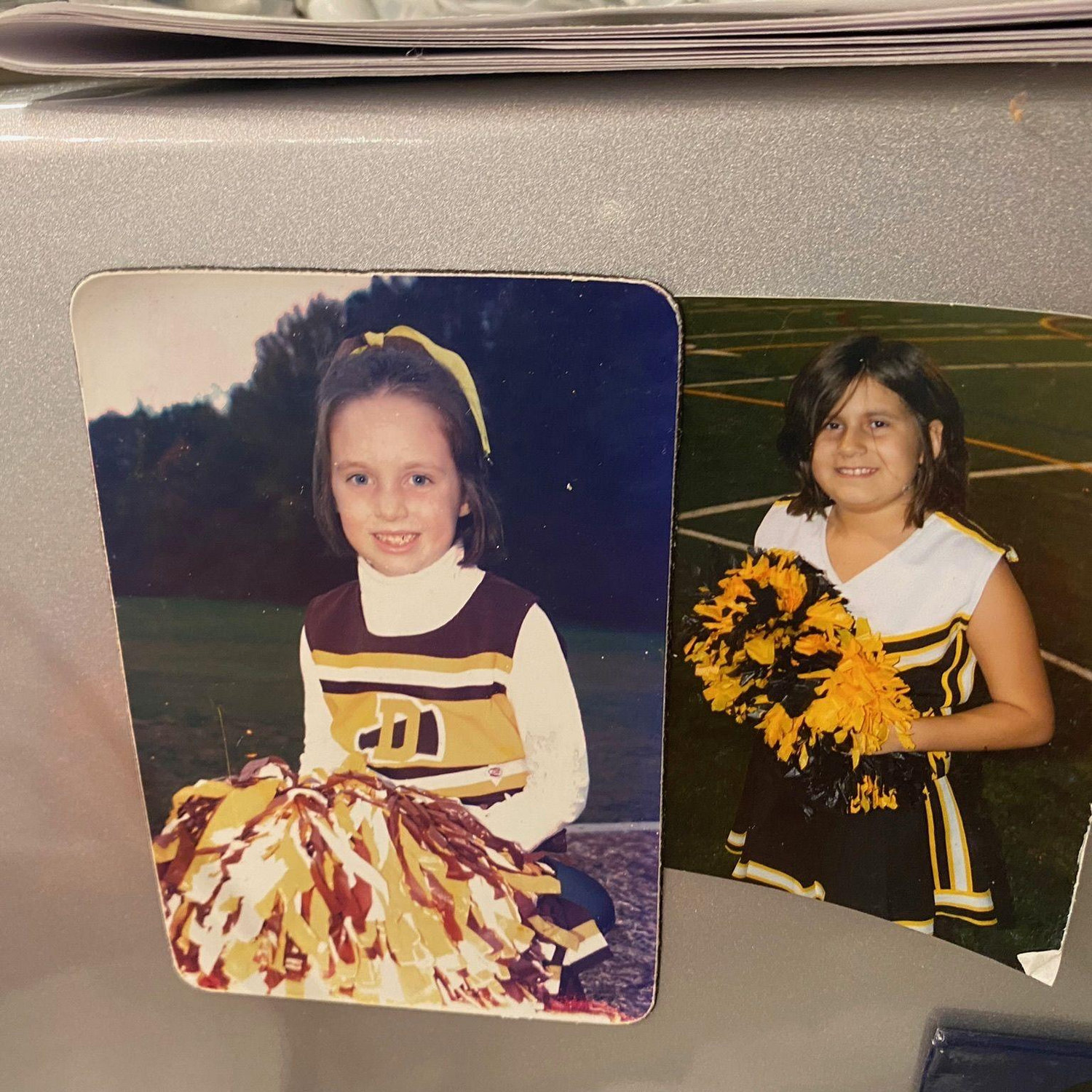 Who knew these two girls cheering for neighboring towns would get married one day?