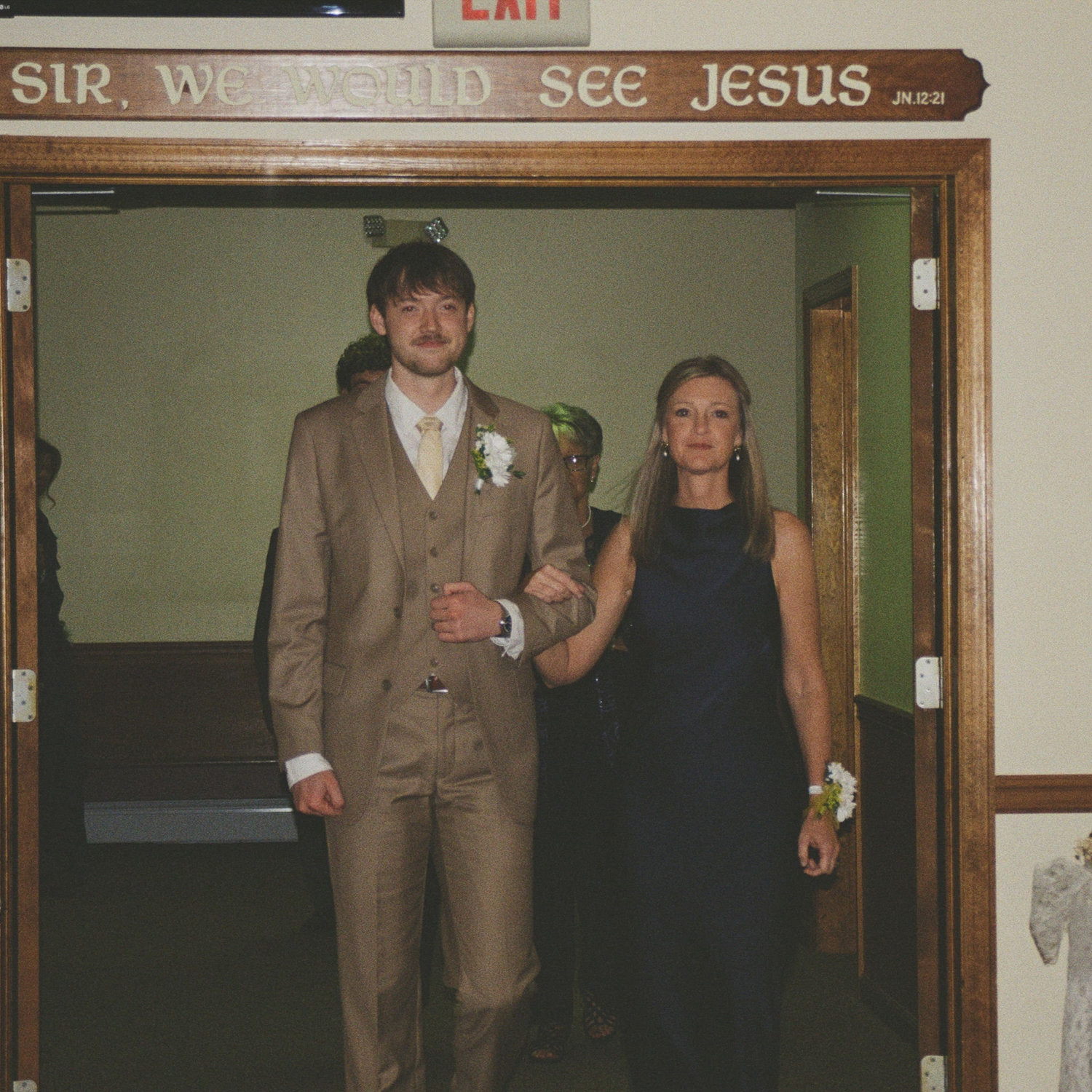 Noah and his mom entering the ceremony.