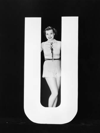 Woman Posing with Huge Letter U Photographic Print by Everett Collection at Art.com