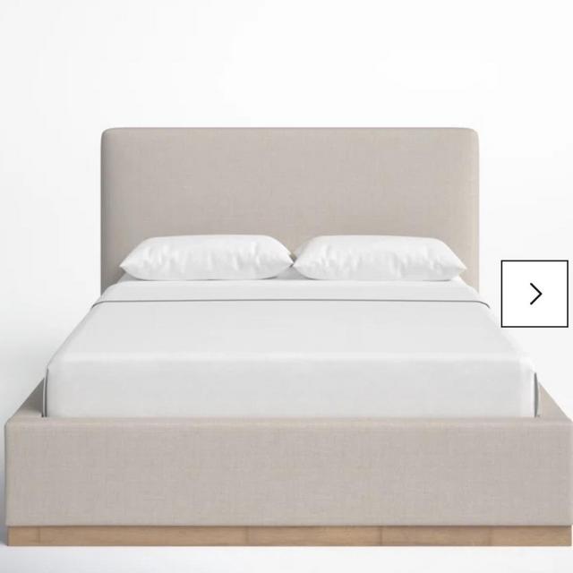 Delpha Grounded Upholstery Wood Bed Frame