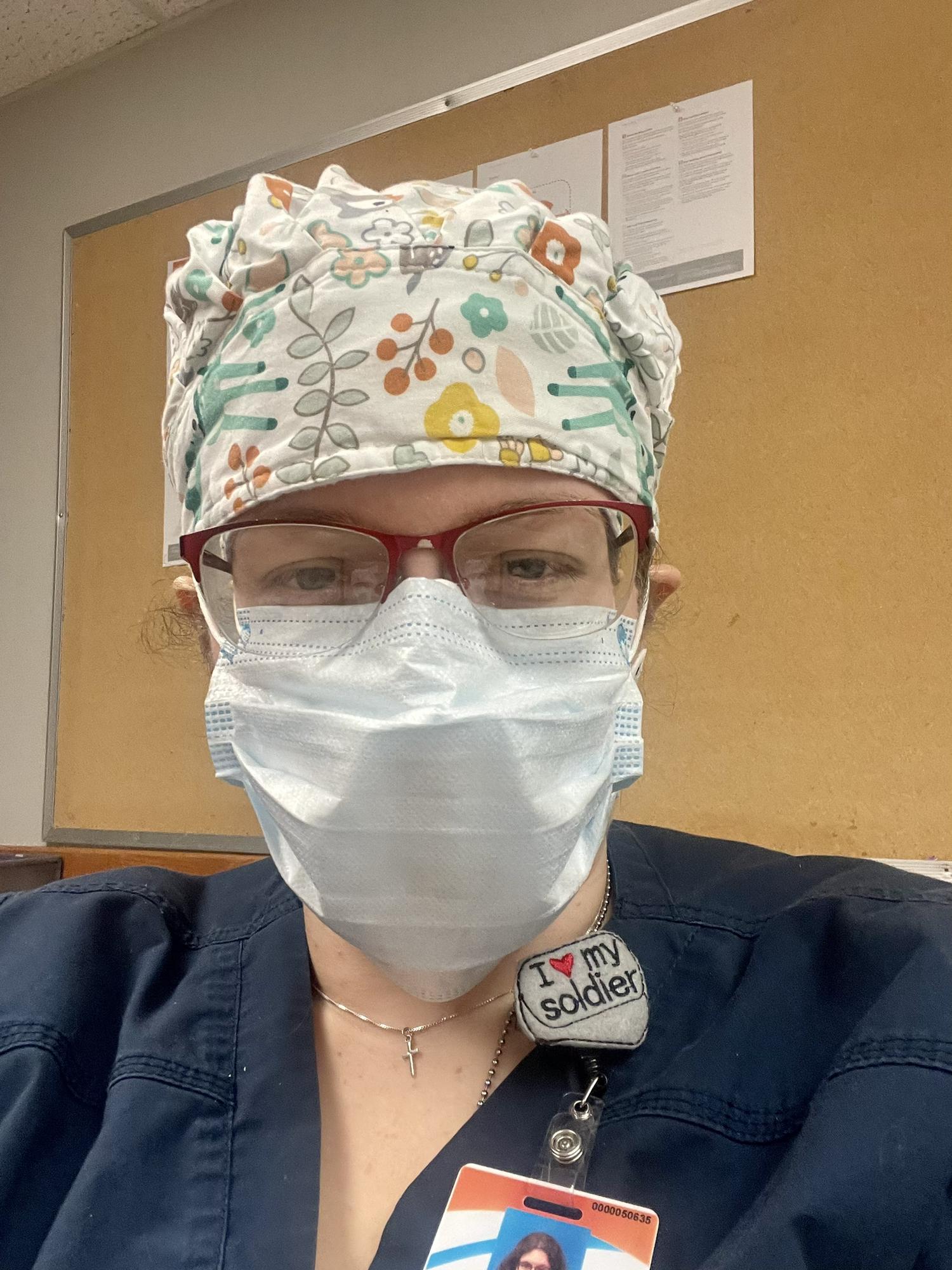 Danielle doing that COVID nursing thing.