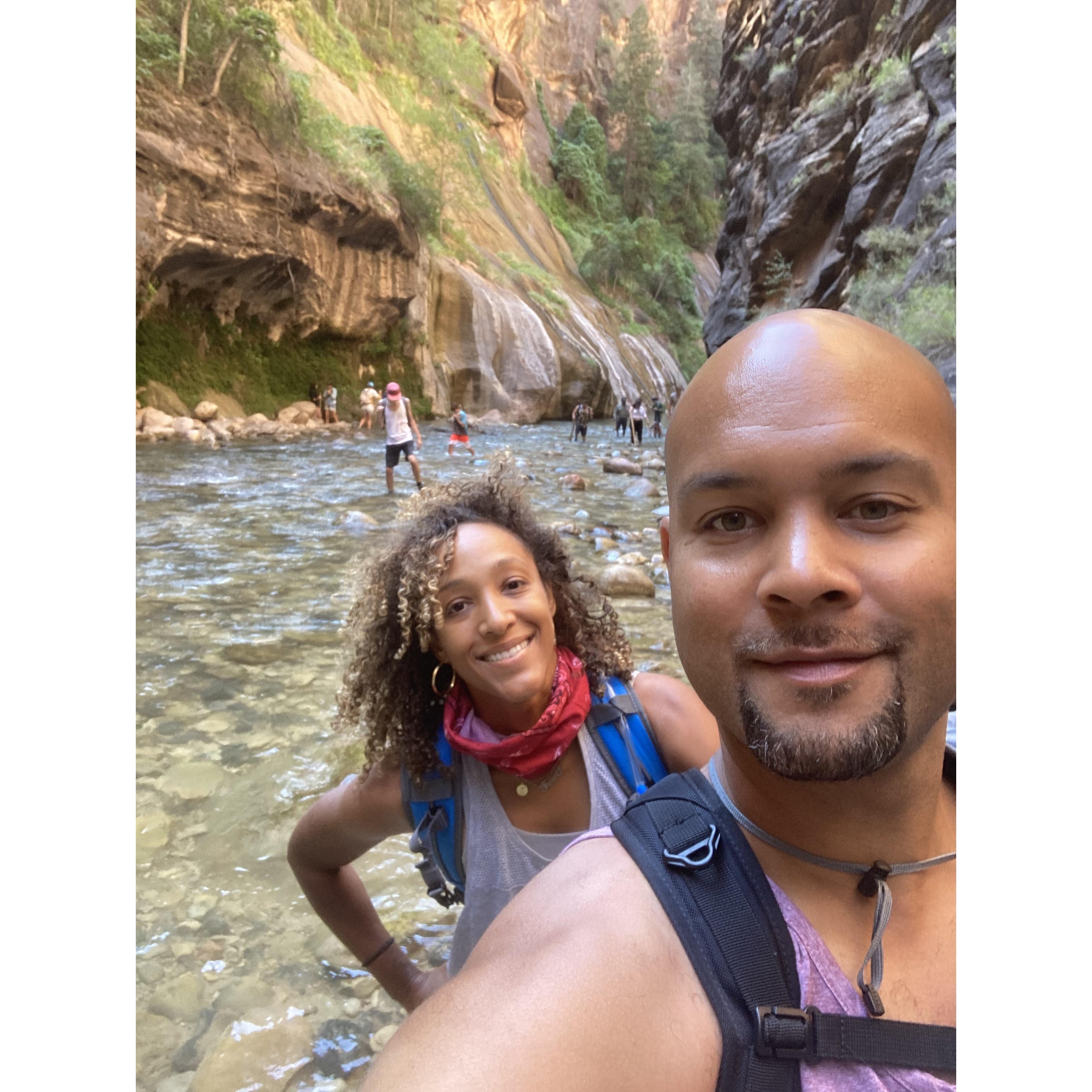 Us hiking the Narrows at Zion National Park. Typical Traci, leaving Eddie behind on a hike.