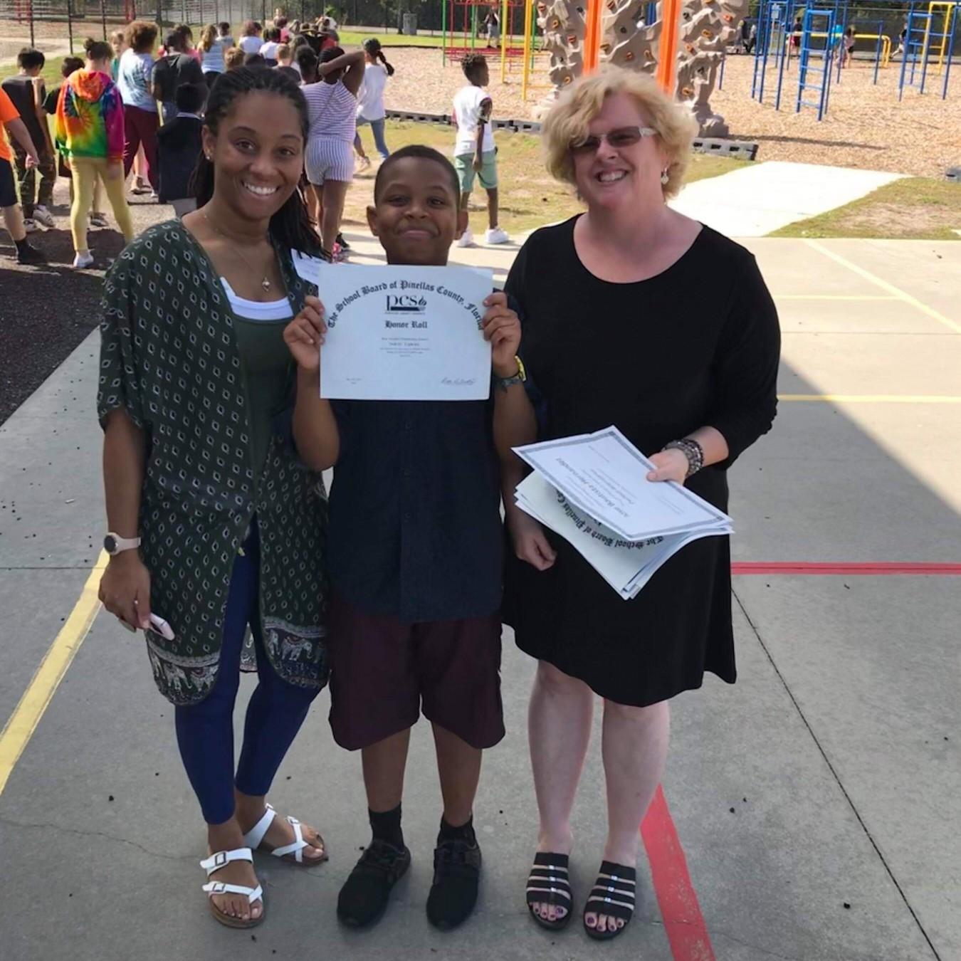 Honor Roll: Adorable and super smart! This big brother made Honor Roll the first semester! Way to go, Dekilo!