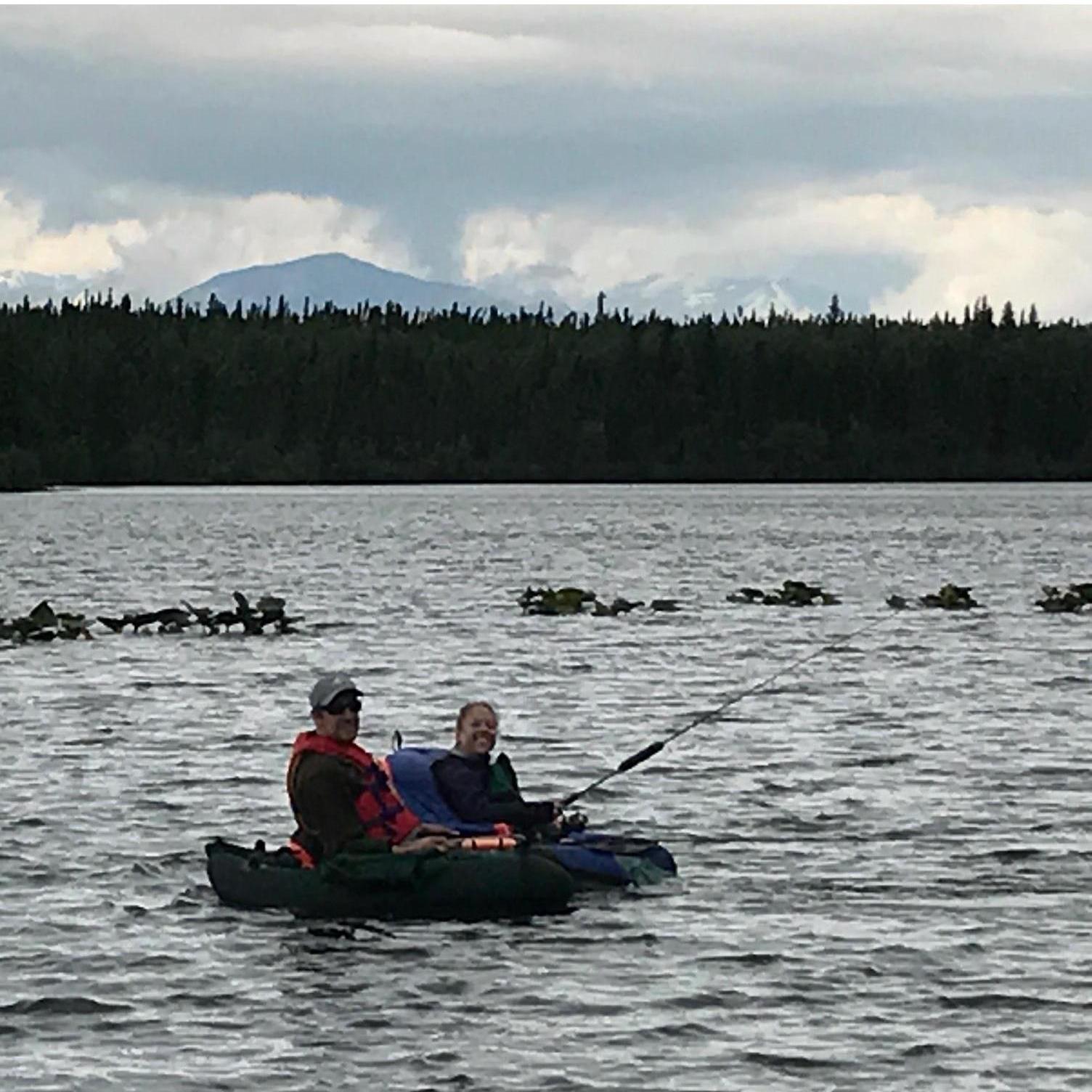 Float tubing in Alaska. Once again, Kristen out numbers Danny in the number of fish caught!