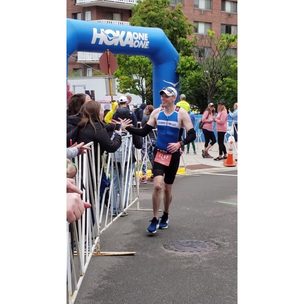 Emily cheering Dan on while he was completing his Iron Man