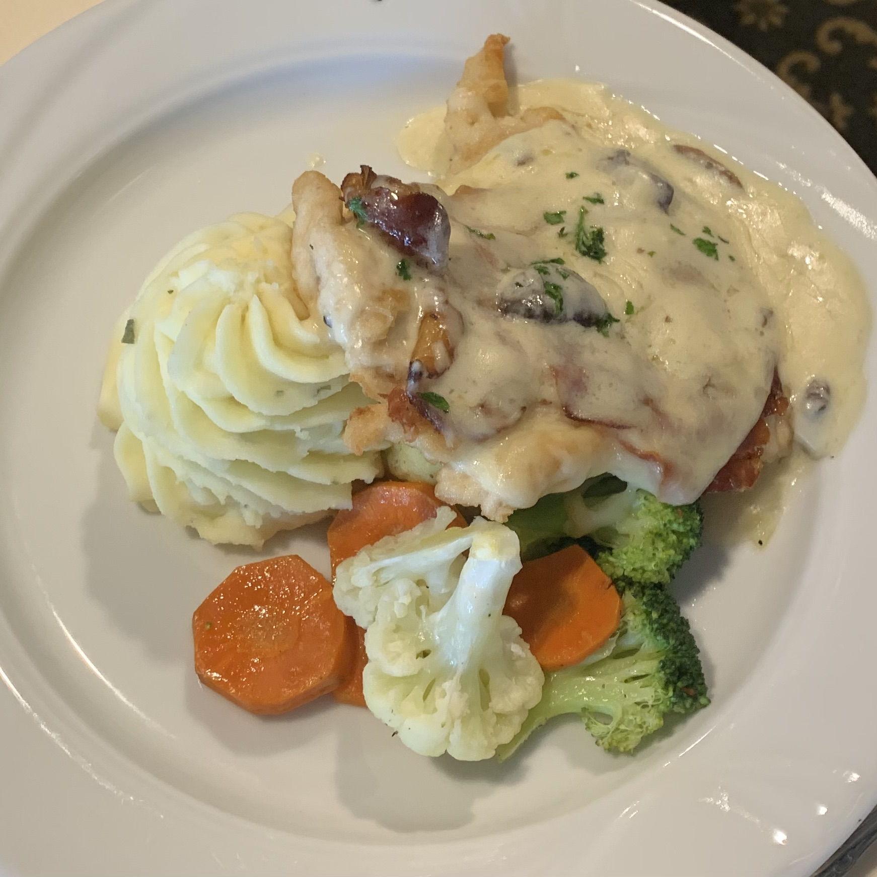 Chicken Carbonara:
Boneless breast of chicken sautéed with thinly slicedproscuitto ham and served with a sauce of dicedonions, sliced mushrooms, romano cheese and cream