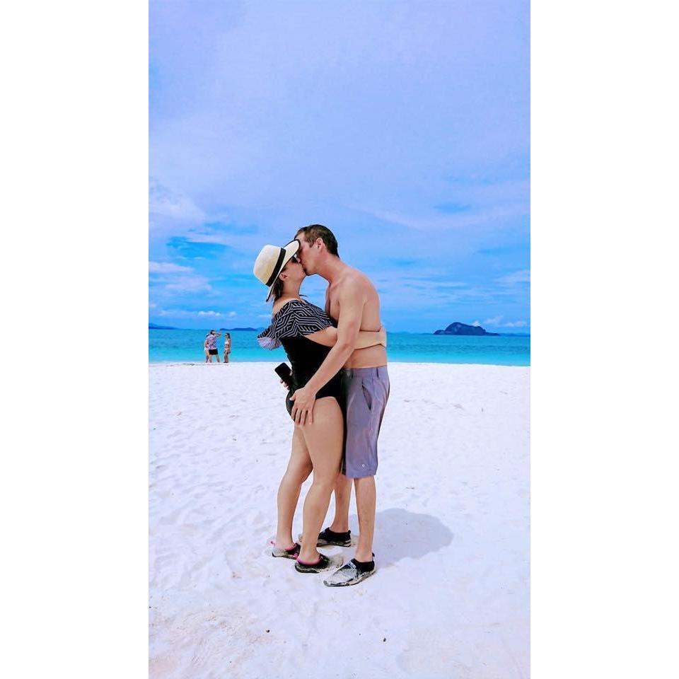 Kissing off the coast of Phuket, Thailand, November 2018.